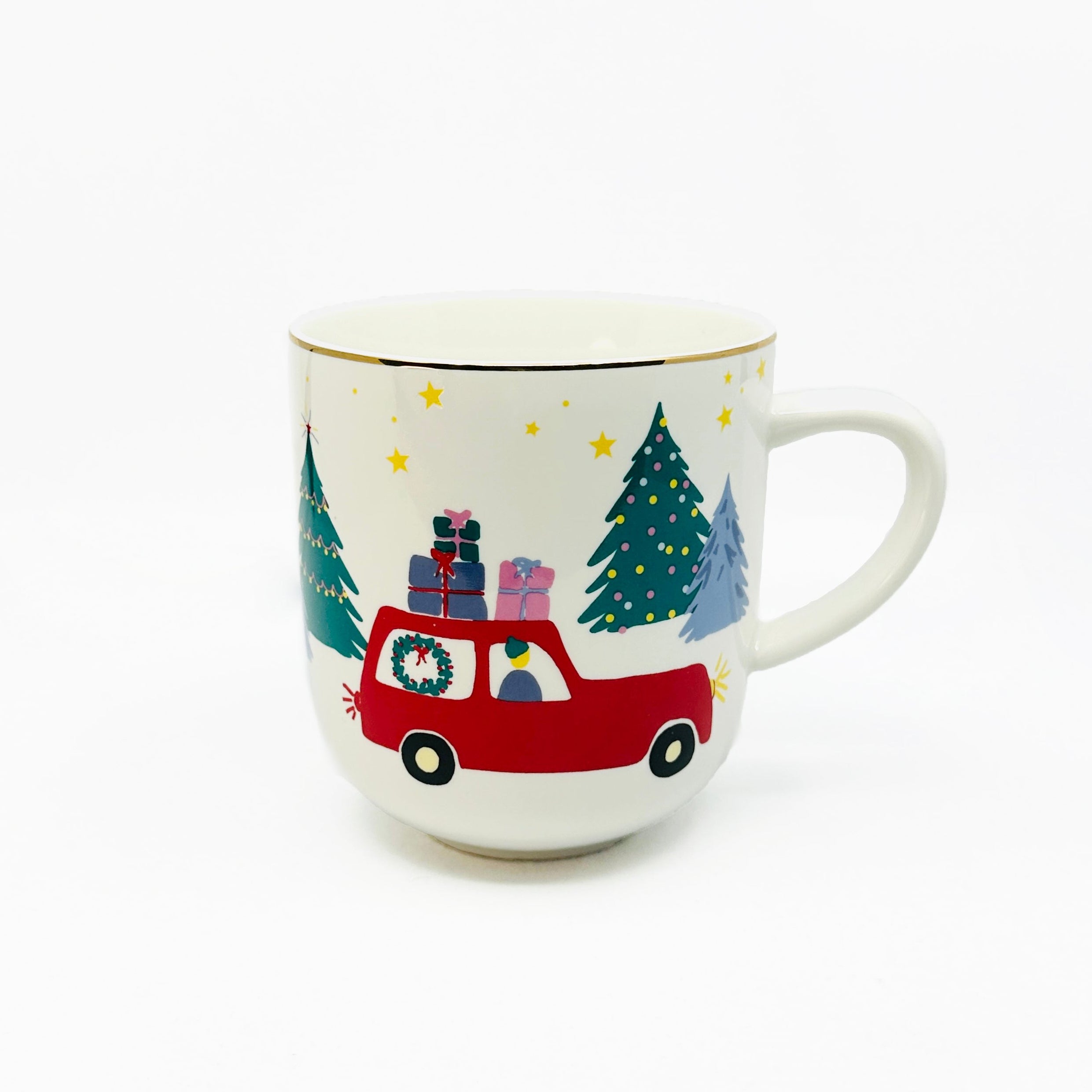 A white porcelain jumbo mug with a Christmas design, featuring a red car, Christmas tree, and snow.