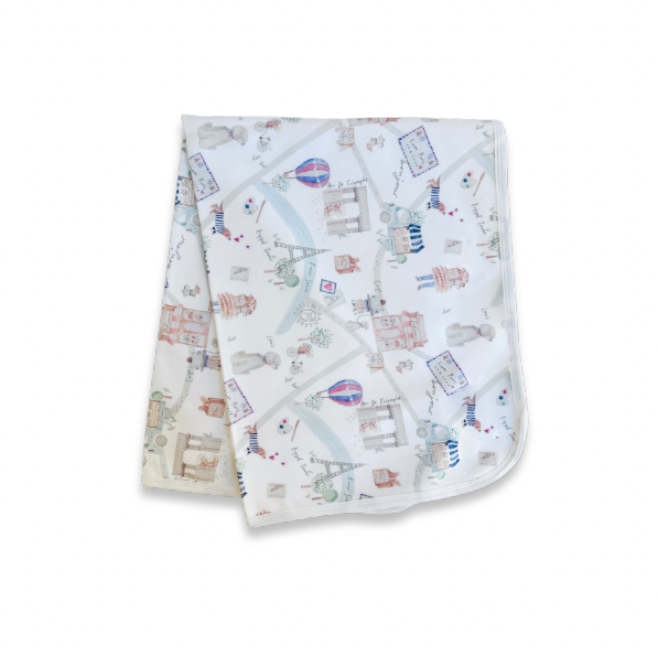 Baby blanket with travel-themed design on a white background