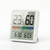 Digital thermometer and humidity meter on a white background