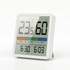 Digital thermometer and humidity meter on a white background