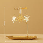 Snow flake rotary spinning tea light candle holder